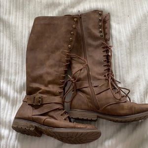 Laced up brown leather boots